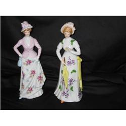 2 hand-painted porcelain figurines - 10" tall x 4"wide - 1 is pink w/roses the other is yellow w/vio