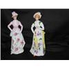 Image 1 : 2 hand-painted porcelain figurines - 10" tall x 4"wide - 1 is pink w/roses the other is yellow w/vio