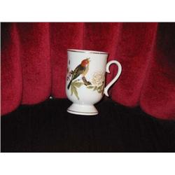 4 white porcelain footed mugs w/gold trim - pattern is Chinese garden