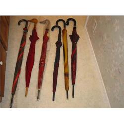 6 new umbrellas by Aramis - various designs - bid will be 6 times the money