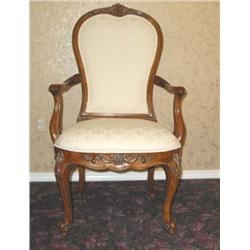 2 French style arm chairs w/carved decoration in fruitwood w/cabriole legs upholstered in cream shel