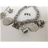 Image 2 : Sterling silver bracelet, charms, brooch