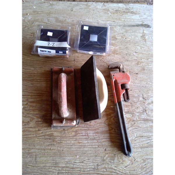 2 4 1/4 " bumper plugs, gyproc sander and pipe wrench