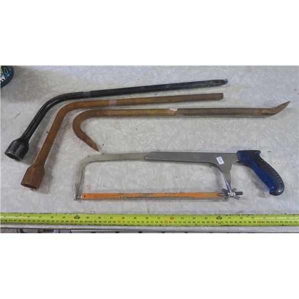 hacksaw, prybar and 2 tire irons