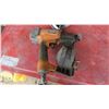 Image 3 : rigid air nailer with lots of nail reloads
