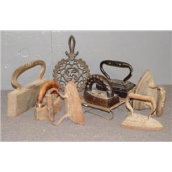 TRAY LOT OF SAD IRONS AND TRIVETS
