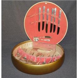 SET OF ROGERS SILVERPLATED FLATWARE IN ROUND CASE