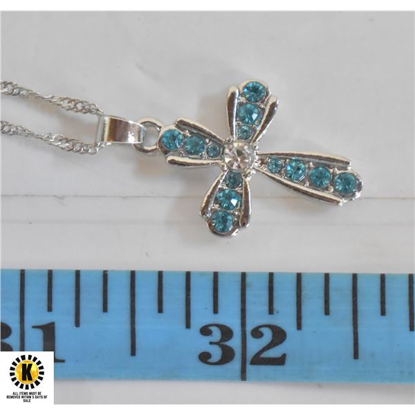 CROSS PENDANT WITH GRADUATED BLUE STONES