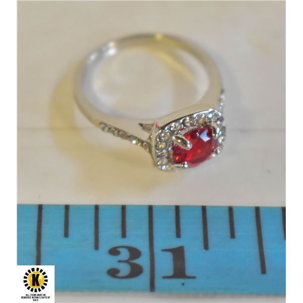 RUBY COLORED CENTER WITH CLEAR ACCENTS