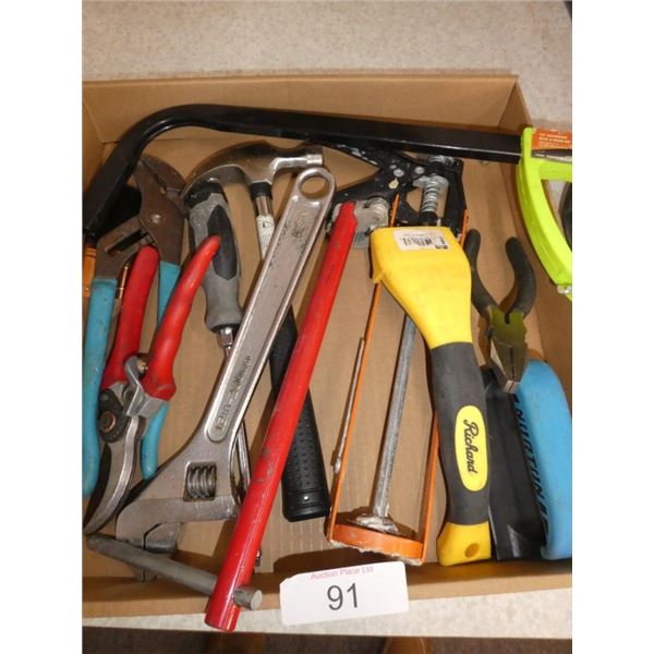 wrenches, hammer, caulking gun, saw, pliers