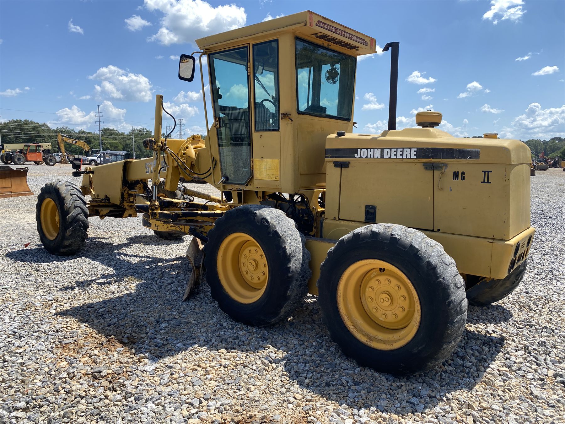 1996 JOHN DEERE 570B Motor Grader - J.M. Wood Auction Company, Inc.