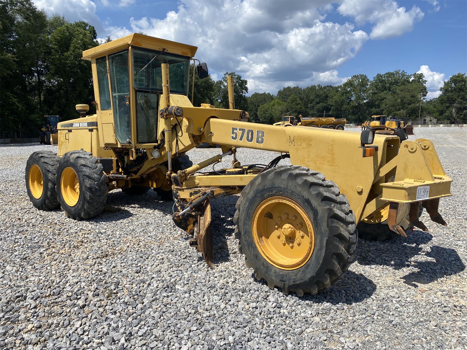 1996 JOHN DEERE 570B Motor Grader - J.M. Wood Auction Company, Inc.
