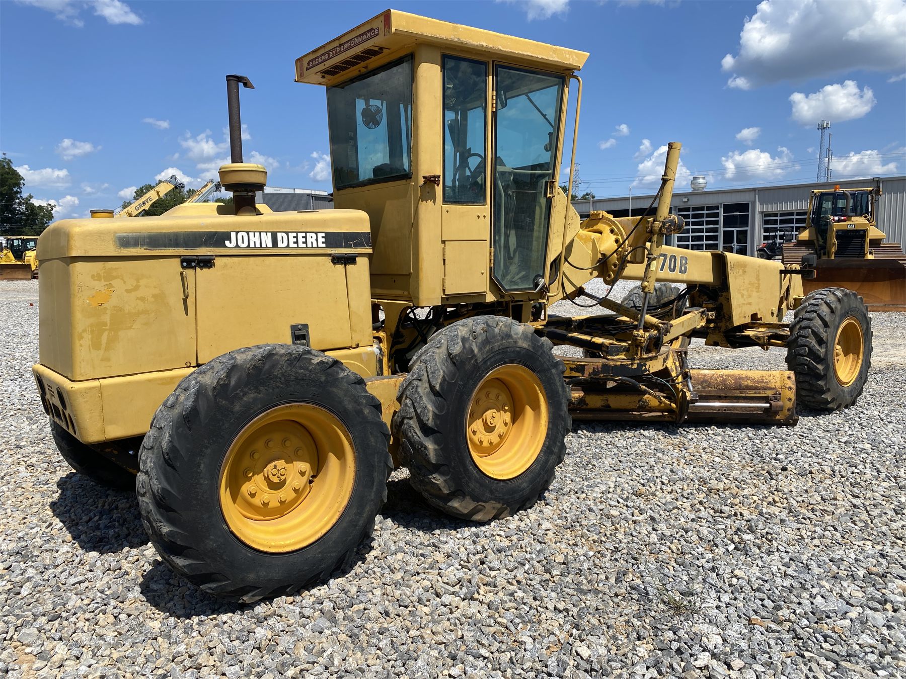 1996 JOHN DEERE 570B Motor Grader - J.M. Wood Auction Company, Inc.