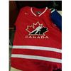 Image 2 : PADDED MOTORCYLES PANTS SIZE 36 WITH TEAM CANADA JERSEY SIZE LARGE AND CANUCKS PATTERN JERSEY