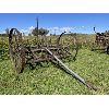 Image 1 : ANTIQUE CULTIVATOR W/ IMP SEAT & 4 FOOT STEEL WHEELS