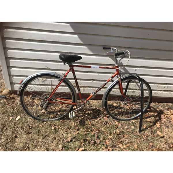 Orange Sprinter Bicycle & Norco Bike Rack