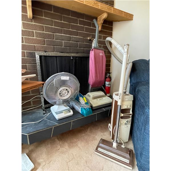 Assortment Of Vacuums And A Desk Fan