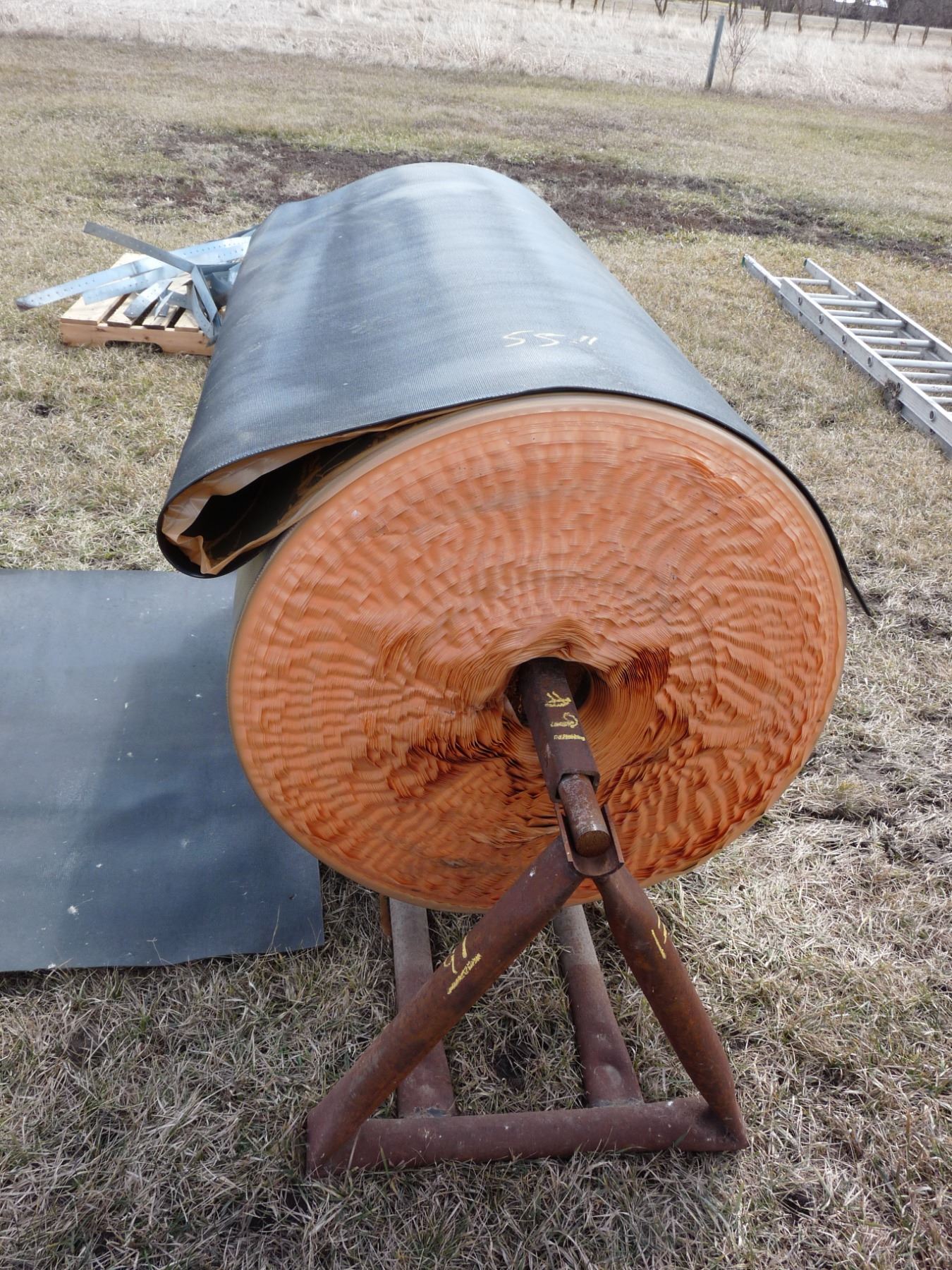 Roll Depth Roll of belting used to line cattle troughs; Width is 55 inches and the ...