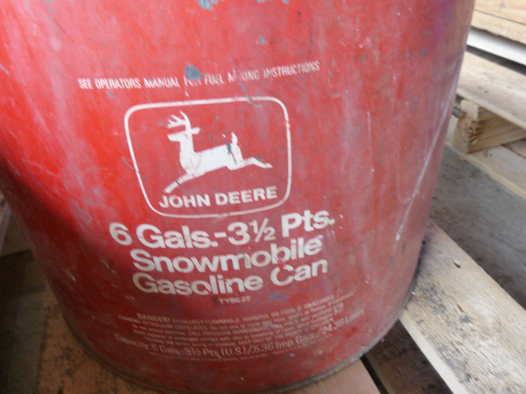 John Deere 6 gallon snowmobile gas can and two other gas cans