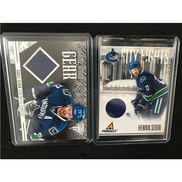 LOT OF 2 PANINI CARDS DANIEL AND HENRICK SEDIN GAME WORN GEAR