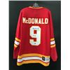 Image 1 : LANNY MCDONALD SIGNED AND INSCRIBED CALGARY FLAMES VINTAGE JERSEY (EAST COAST COA)