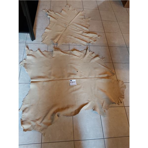 Two Animal Hides - Larger - 47L x 35W  Small - 39L x 36W
