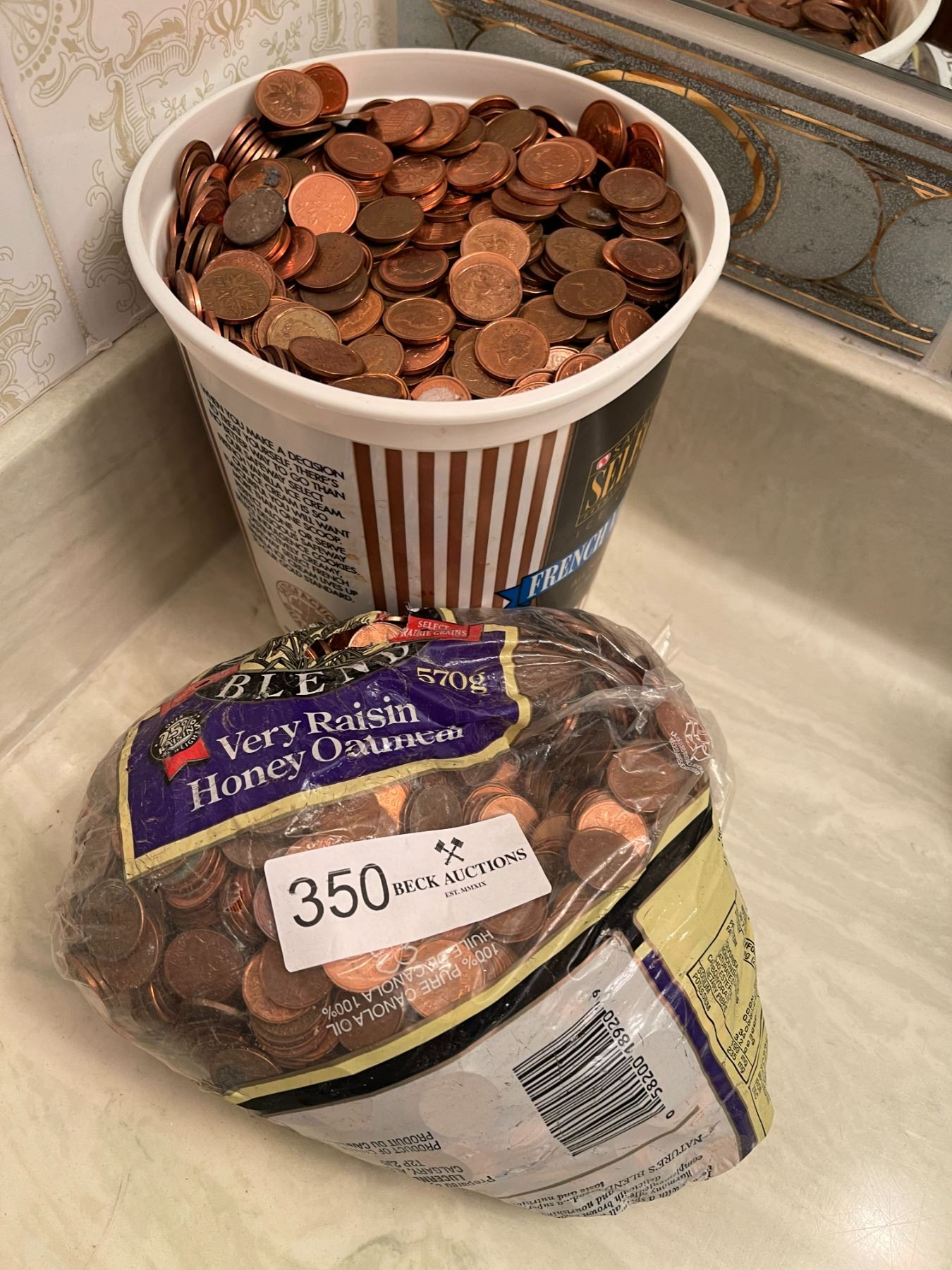 Giant bucket of pennies! Beck Auctions Inc.