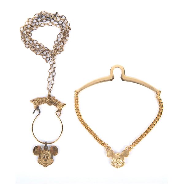 A Mickey Head Tie Bar & Necklace.