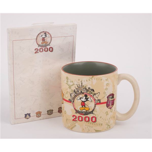 A Year 2000 Coffee Mug and Notepad.