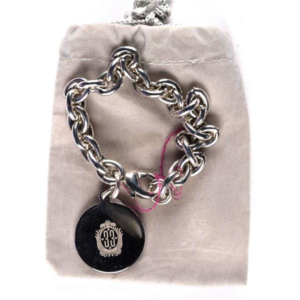 A Club 33 Charm Bracelet in Bag.