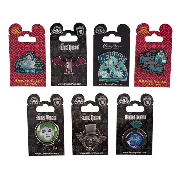 A Collection of (7) Haunted Mansion Disney Parks Pins.