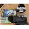 Image 1 : 2 Canon Film Cameras + 2 pocket data banks + assorted manuals