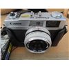 Image 2 : 2 Canon Film Cameras + 2 pocket data banks + assorted manuals