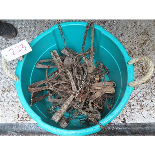 Tub of Leghold traps and parts