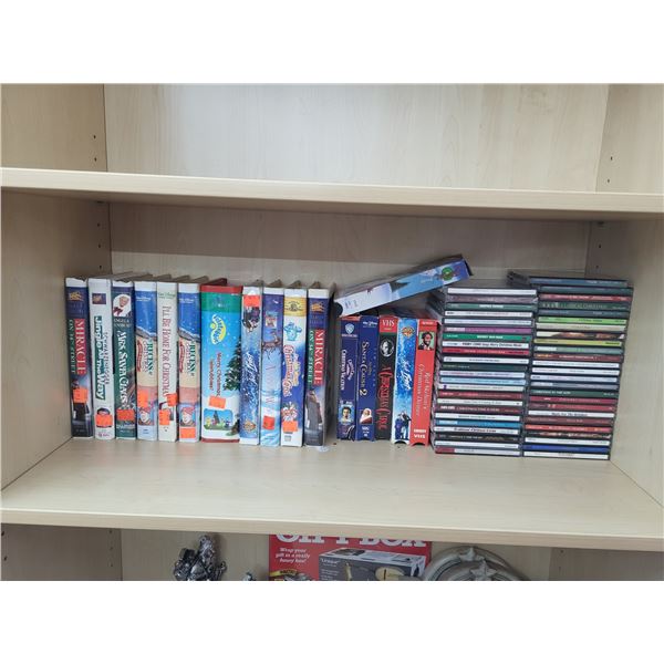 SHELF WITH CHRISTMAS VHS AND CDS (TELETUBBIES)