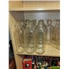 Image 1 : LOT OF 14 OLD GLASS MILK BOTTLES (4899 ON THE BOTTOM)