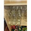 Image 2 : LOT OF 14 OLD GLASS MILK BOTTLES (4899 ON THE BOTTOM)
