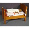 Image 1 : DOLL'S BED WITH BEDDING AND DOLL