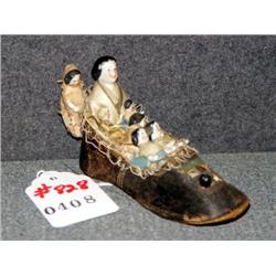 VICTORIAN DOLL'S SLIPPER WITH 7 PORCELAIN DOLL HOU