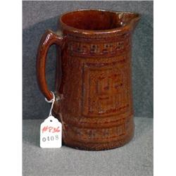 INDIAN PEACE SIGN DECORATED BROWN STONEWARE PITCHE