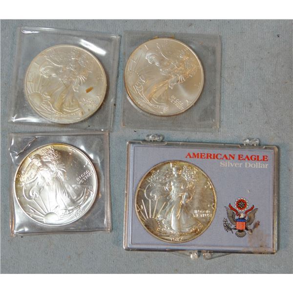 (4) Silver Eagle coins: 1987, 2-1997, 1-1995