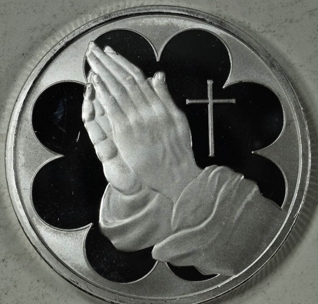 ONE OZ .999 PRAYING HANDS SILVER ROUNDS