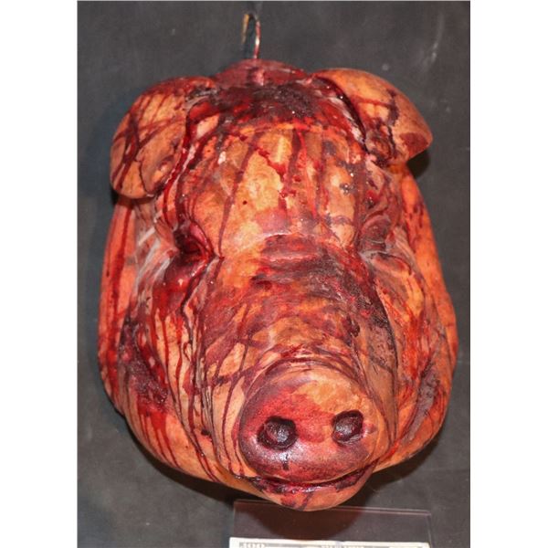 SEVERED BLOODY PIG HEAD ON HANGER
