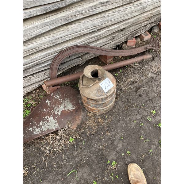 Old oil pail & parts of a plow
