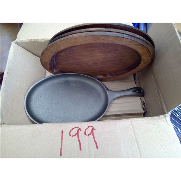 Cast Iron sizzle plates (4) and wood servers (4)