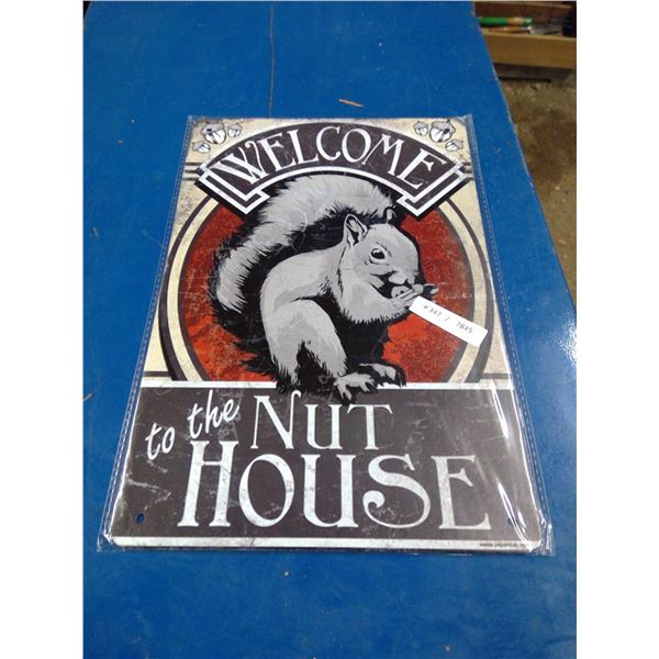 approx 8 X 11 3/4 tin sign " nut house"