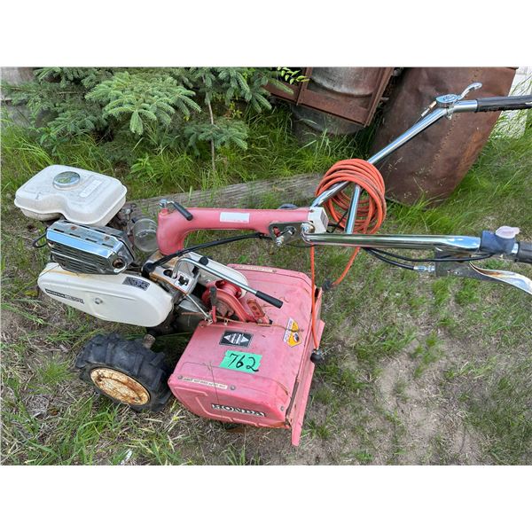 Honda FR500 rototiller. Back fires through carb when primed with gas.
