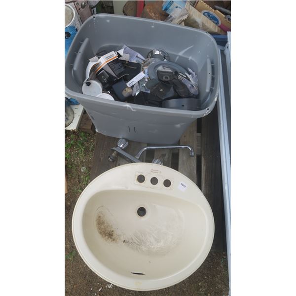 bucket of assorted plumbing - sink, faucet, fittings, etc.