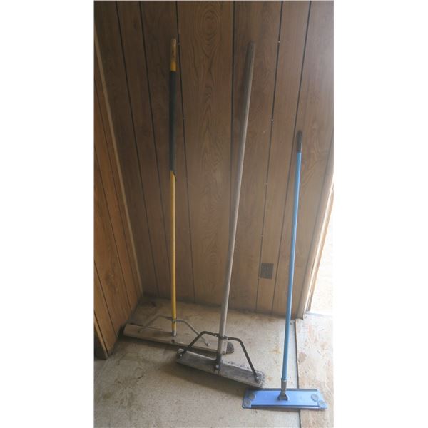 2 push brooms and mop