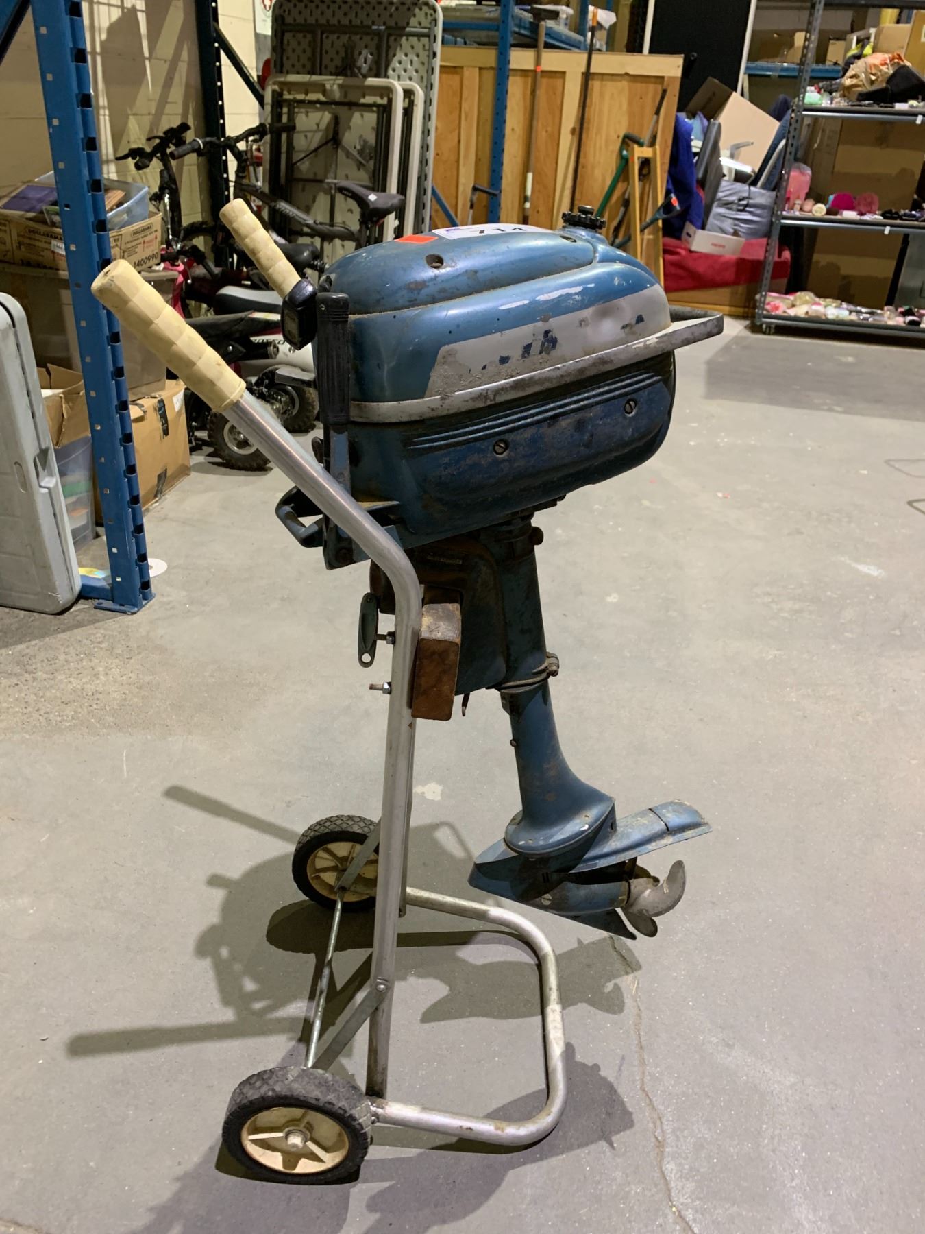 EVANRUDE OUTBOARD MOTOR ON ROLLING STAND - Able Auctions